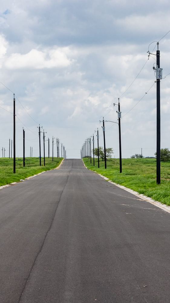 Paved road with utility poles